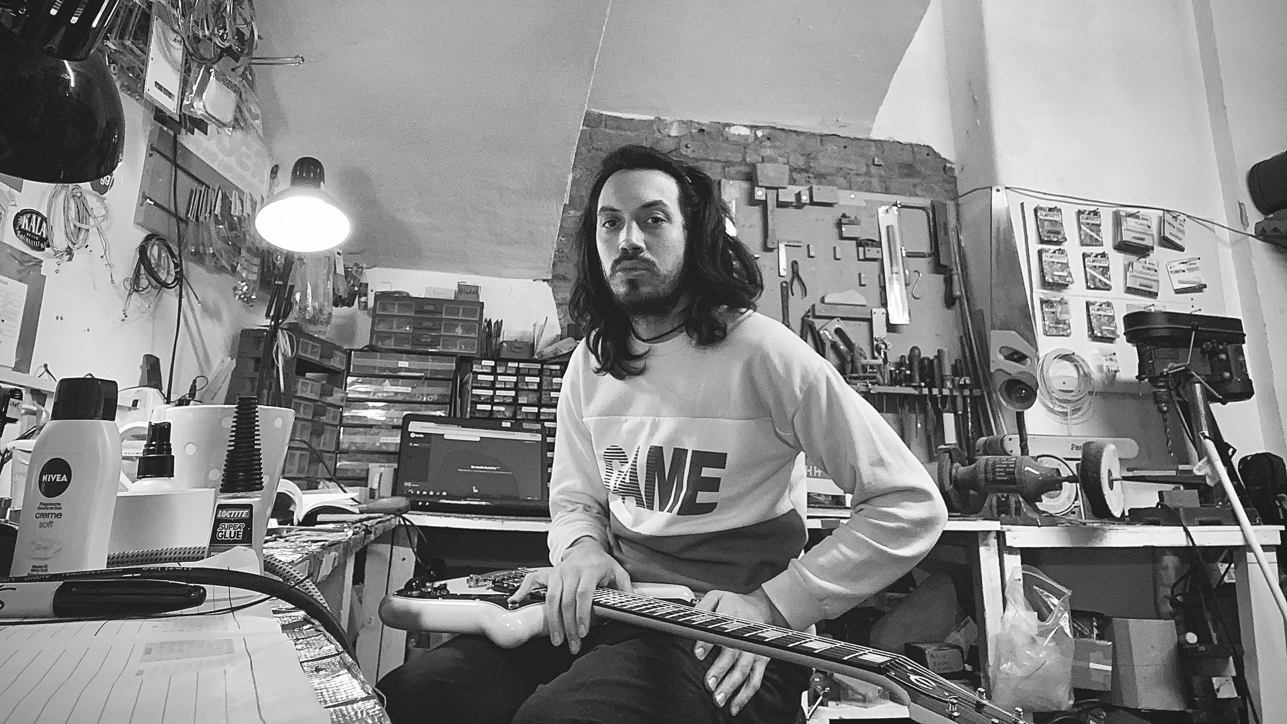 Juan Ignacio Diaco Vidal working on a guitar at the London Guitar Repairs workshop